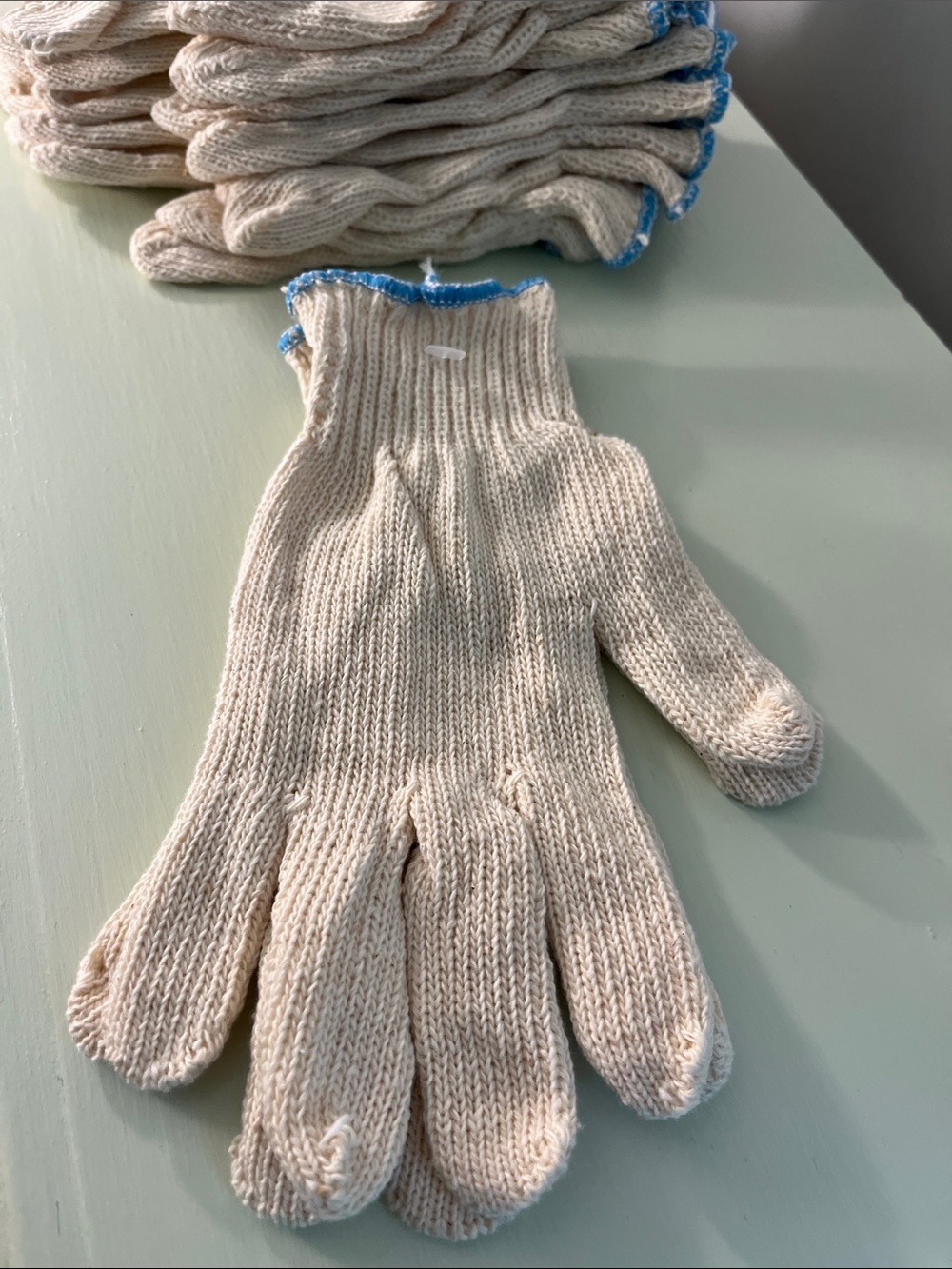 12 Pair Cotton/Poly String Knit Gloves with Blue Trim - Size Small